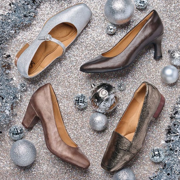 Featuring tThe Elsey in silver, Samy heel in Espresso, Lana heel in Bronze and Eldyn heel in Bronze ona sparkled background surrounded by holiday decorations.